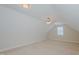 Large bonus room with a ceiling fan, neutral walls, carpet floors, and a bright window at 308 Grove Hall Ln, Mebane, NC 27302