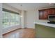 Charming breakfast nook with bright light, and wood floors at 308 Grove Hall Ln, Mebane, NC 27302