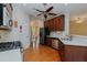 Open kitchen with view of living room, stainless steel appliances, and a kitchen island at 308 Grove Hall Ln, Mebane, NC 27302