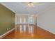 Spacious living room boasts gleaming hardwood floors and an open-concept design with arched doorways at 308 Grove Hall Ln, Mebane, NC 27302