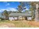 Spacious backyard featuring a wooden deck, perfect for outdoor entertaining and relaxation at 3100 Greenville Loop Rd, Wake Forest, NC 27587