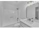 Bright bathroom features modern fixtures, a tub with shower, and a quartz vanity at 3100 Greenville Loop Rd, Wake Forest, NC 27587