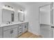 Bathroom features dual sinks, modern fixtures, and hardwood floors at 3100 Greenville Loop Rd, Wake Forest, NC 27587