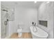 Bathroom featuring glass enclosed shower, soaking tub, and tile accents at 3100 Greenville Loop Rd, Wake Forest, NC 27587