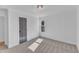 Bedroom featuring soft carpeting, white walls, modern light fixture, and natural lighting at 3100 Greenville Loop Rd, Wake Forest, NC 27587