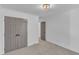 Neutral bedroom featuring plush carpeting, white walls, doors, and modern lighting at 3100 Greenville Loop Rd, Wake Forest, NC 27587