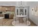 Charming dining area with a round table, bay window, and stylish chandelier at 3100 Greenville Loop Rd, Wake Forest, NC 27587