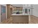 Bright kitchen with island, stainless steel sink, ample countertop space, and updated cabinets at 3100 Greenville Loop Rd, Wake Forest, NC 27587
