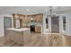 Spacious kitchen with island, light wood cabinets, stainless appliances, and adjacent dining area at 3100 Greenville Loop Rd, Wake Forest, NC 27587