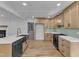 Modern kitchen features sleek countertops, stainless steel appliances, and light wood cabinetry at 3100 Greenville Loop Rd, Wake Forest, NC 27587