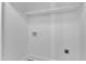White laundry room with shelving and modern connections at 3100 Greenville Loop Rd, Wake Forest, NC 27587