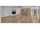 Open concept living area flows from the modern kitchen to the fireplace living room at 3100 Greenville Loop Rd, Wake Forest, NC 27587