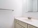 Clean bathroom featuring a gray vanity, white countertop, and a sleek mirror at 3125 Morningside Dr, Raleigh, NC 27607