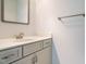 Clean bathroom featuring a gray vanity, white countertop, and sleek mirror at 3125 Morningside Dr, Raleigh, NC 27607