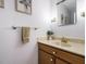Traditional half bathroom featuring gold fixtures, artwork, and a towel rack at 3125 Morningside Dr, Raleigh, NC 27607