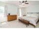Bright bedroom with neutral tones, a wood dresser, and a padded bench at 3125 Morningside Dr, Raleigh, NC 27607