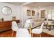 Stylish dining room with hardwood floors, modern furniture, and an open layout to living area at 3125 Morningside Dr, Raleigh, NC 27607