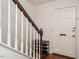 Bright entryway featuring white walls, hardwood floors, with stairs and coat closet at 3125 Morningside Dr, Raleigh, NC 27607
