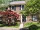 Charming brick townhouse with black shutters and a well-maintained front yard, perfect for suburban living at 3125 Morningside Dr, Raleigh, NC 27607