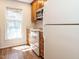 Bright kitchen with white appliances, wooden cabinets, and a view from the window at 3125 Morningside Dr, Raleigh, NC 27607