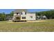Backyard view showing deck and lush green grass. New construction at 317 Hampshire Court, Four Oaks, NC 27524