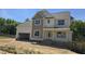 Newly built, two-story home with an attached garage, awaiting final touches at 317 Hampshire Court, Four Oaks, NC 27524