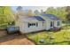 Overhead view of the large backyard that features outbuildings and a gray back deck at 322 W Hill N Ave, Hillsborough, NC 27278