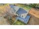 Birds eye view showcasing the back of the house with the back deck and fenced yard at 322 W Hill N Ave, Hillsborough, NC 27278