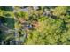 Aerial view of the property, displaying the home's layout and surrounding greenery for a picturesque setting at 322 W Hill N Ave, Hillsborough, NC 27278
