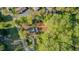 Aerial view of the property nestled among mature trees, offering a serene and private setting at 322 W Hill N Ave, Hillsborough, NC 27278