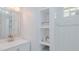 Bright white bathroom featuring tile and built-in shelving at 322 W Hill N Ave, Hillsborough, NC 27278