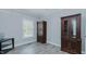 Bedroom featuring light gray walls, wood-look floors and natural light at 322 W Hill N Ave, Hillsborough, NC 27278