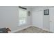 Bedroom featuring wood-look floors, a window, and double door closet at 322 W Hill N Ave, Hillsborough, NC 27278