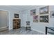 Bedroom featuring light gray walls, wood-look floors and multiple framed photos at 322 W Hill N Ave, Hillsborough, NC 27278