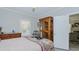 Bedroom with hardwood style floors, dresser, and soft gray walls at 322 W Hill N Ave, Hillsborough, NC 27278