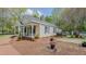 Inviting exterior with a quaint front porch and a side deck perfect for entertaining or relaxing at 322 W Hill N Ave, Hillsborough, NC 27278