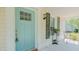 Cozy front porch view showcasing the light-blue door and decorative details at 322 W Hill N Ave, Hillsborough, NC 27278
