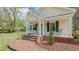 Inviting front porch with a brick walkway and classic architectural details at 322 W Hill N Ave, Hillsborough, NC 27278