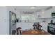 Stylish kitchen showcases white cabinetry, stainless steel appliances, and decorative backsplash, creating a modern culinary space at 322 W Hill N Ave, Hillsborough, NC 27278