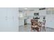 Bright kitchen with white cabinets, stainless steel appliances, and a dining area at 322 W Hill N Ave, Hillsborough, NC 27278