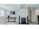 Comfortable living room with a fireplace and elegant white built-in cabinets at 322 W Hill N Ave, Hillsborough, NC 27278