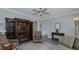 Living room with hardwood floors, a ceiling fan, and a decorative built-in cabinet at 322 W Hill N Ave, Hillsborough, NC 27278