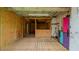 Interior of a spacious shed with a wooden floor, wood-paneled walls, and a built-in counter, offering functional space at 322 W Hill N Ave, Hillsborough, NC 27278