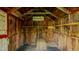Interior of a rustic shed, featuring wooden beams, shelves, and hay bales, creating a charming storage space at 322 W Hill N Ave, Hillsborough, NC 27278