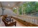 Relax on the back porch with stone accents and wooded views, perfect for enjoying the outdoors at 32430 Archdale, Chapel Hill, NC 27517