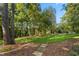 Tranquil backyard featuring a stone pathway that meanders through the lush landscape, creating a peaceful retreat at 32430 Archdale, Chapel Hill, NC 27517