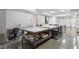 Spacious basement area with table, epoxy floors, and bright lighting at 32430 Archdale, Chapel Hill, NC 27517