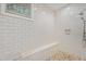 Walk-in shower featuring subway tile, mosaic floor and a built-in bench at 32430 Archdale, Chapel Hill, NC 27517