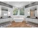 Spa-like bathroom featuring a standalone tub, dual vanities, and modern fixtures at 32430 Archdale, Chapel Hill, NC 27517