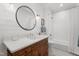 Stylish bathroom with shiplap walls, modern fixtures, and a shower-tub combo for a spa-like experience at 32430 Archdale, Chapel Hill, NC 27517
